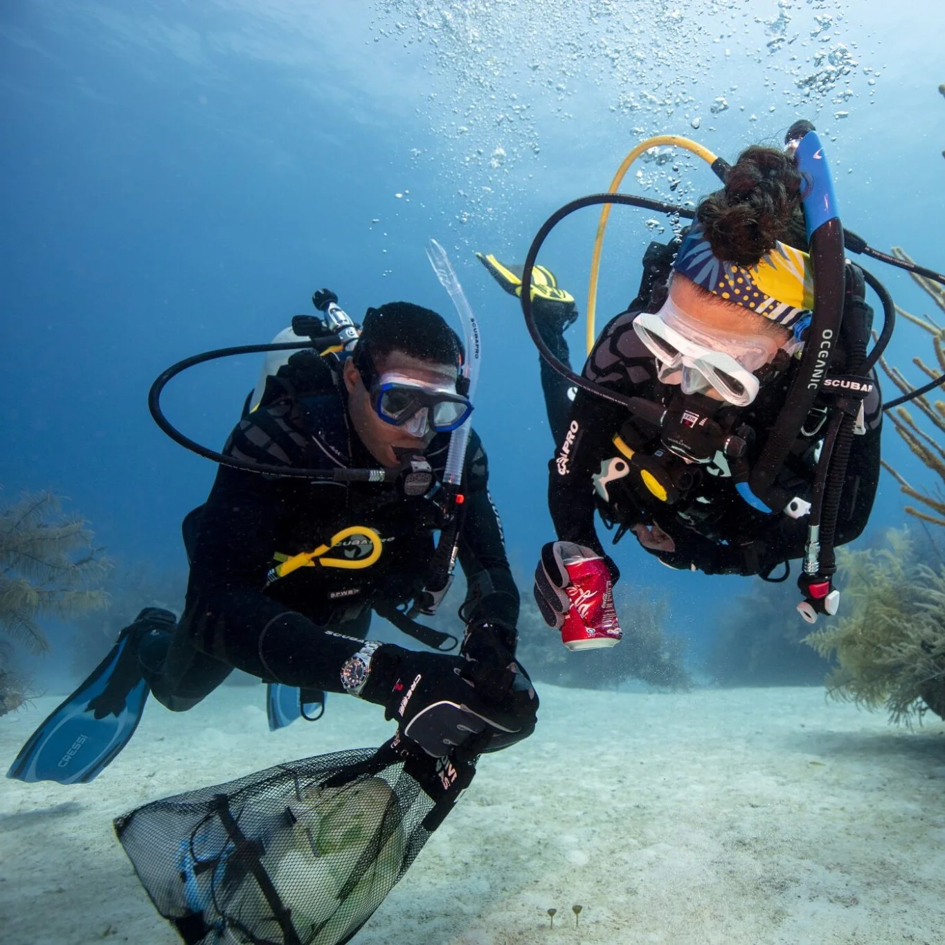 Scuba divers taking part in an underwater rubbish cleanup