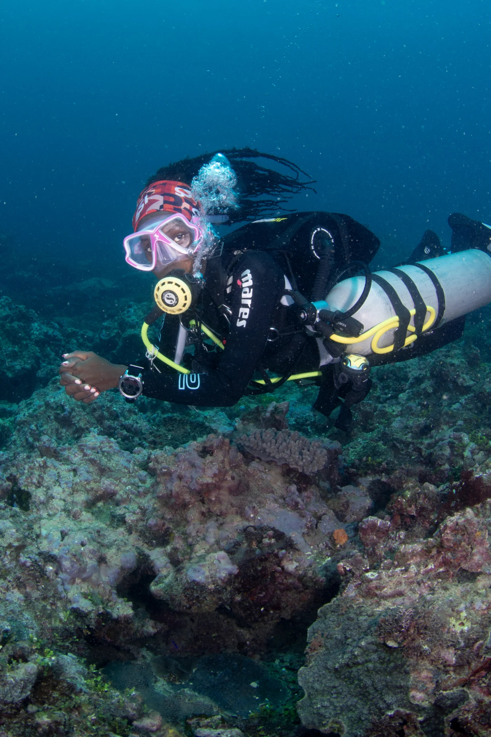 Certified scuba diver exploring Diani's reefs